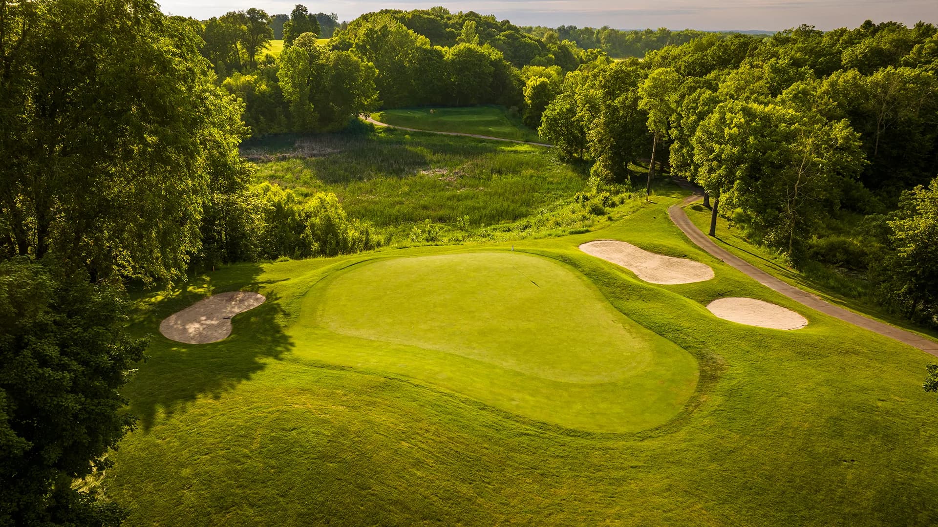Aerial view of a green and its bunkers at The Wilds Golf Club